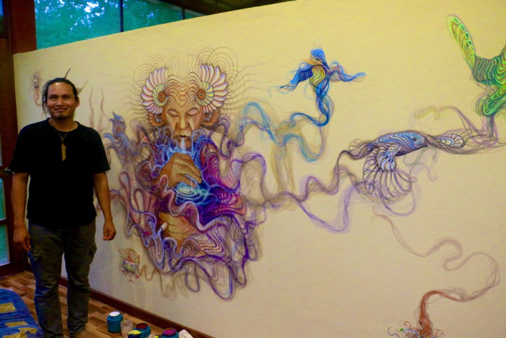 Luis Tamani with his finished mural