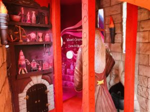 The Wizard in his Dungeon from behind, check out al the detailed shelves with all sorts of magical stuff